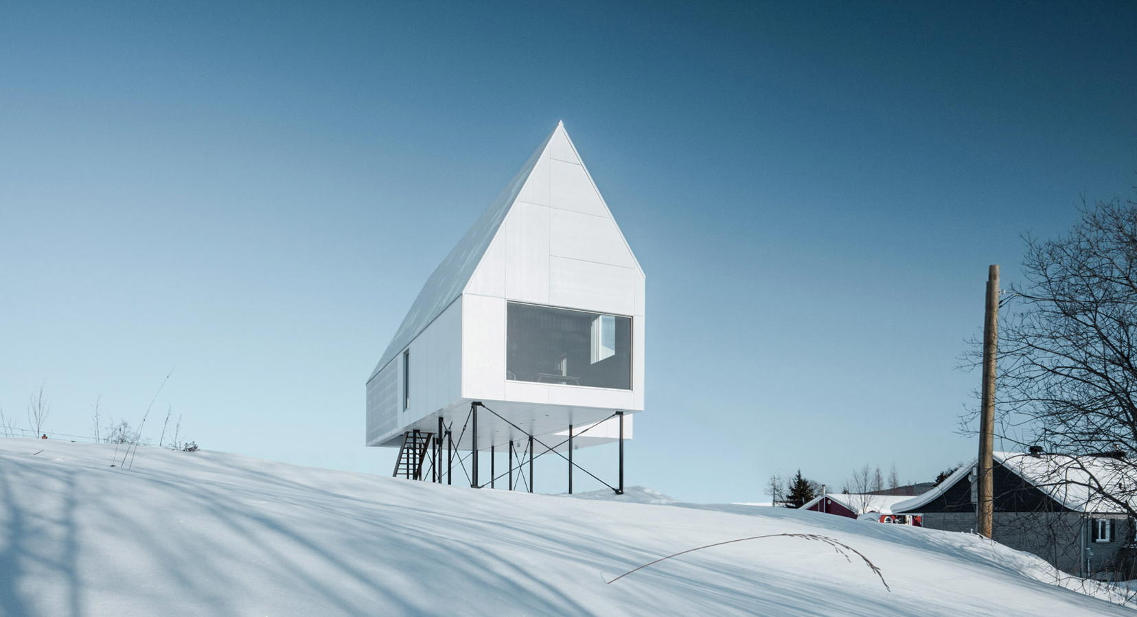 Delordinaire Raises the High House Above Snowy Quebec Countryside