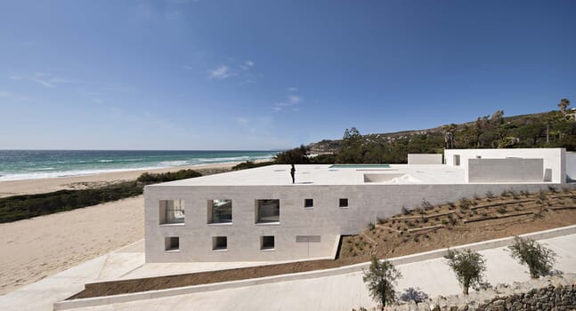 The House of the Infinite: A stone beach house with an incredible roof terrace