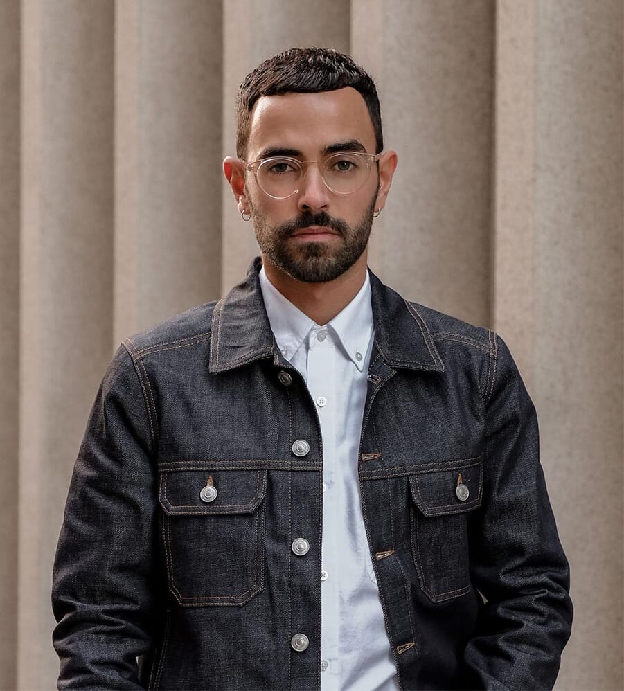 Girbaud Milan Ready to Wear Menswear Spring Summer Model shaved head zip up  two tone denim jacket unbuttoned detail on one side Stock Photo - Alamy