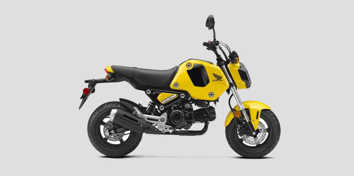 Black and yellow Honda Motorbike