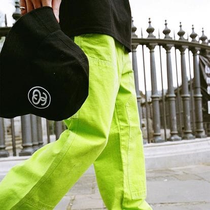 Stussy Neon Green Cargo Pants with Black Hoodie and Bucket Hat