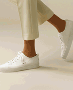 Channel casual cool in a pair of plimsolls