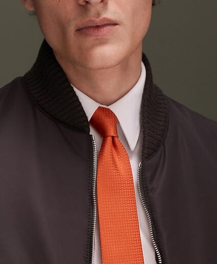 From Cannes to closets: Tracing the history of the iconic Hermes tie