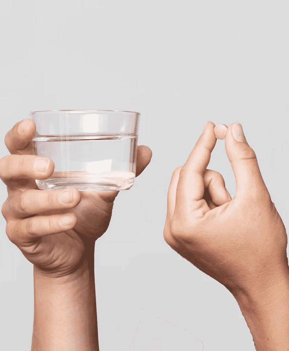 Scandinavian Biolabs , hair growth tablets pill and glass of water